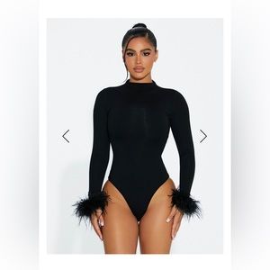Naked wardrobe NWT black feather bodysuit. Sz M.